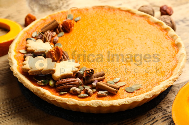 Delicious homemade pumpkin pie on wooden table, closeup