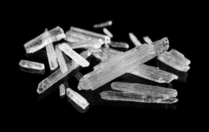 Menthol crystals on black background, closeup view