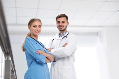 Portrait of doctors in uniform at workplace