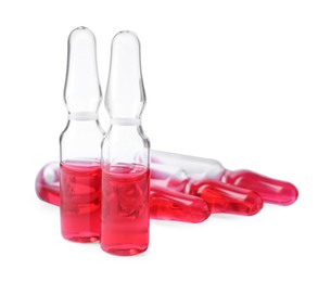Pharmaceutical ampoules with medication on white background
