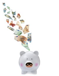 Euro banknotes falling into piggy bank on white background