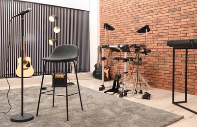 Modern music studio interior with different electronic instruments