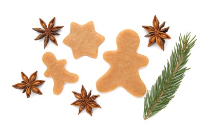 Unbaked Christmas cookies, anise and fir tree twig on white background, top view