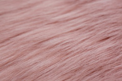 Pink faux fur as background, closeup view
