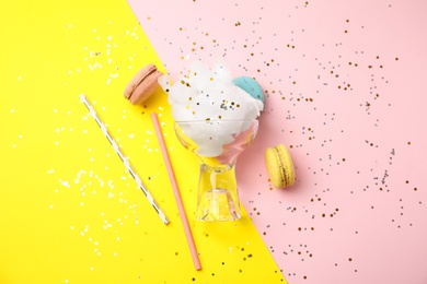 Flat lay composition with sweet cotton candy on color background