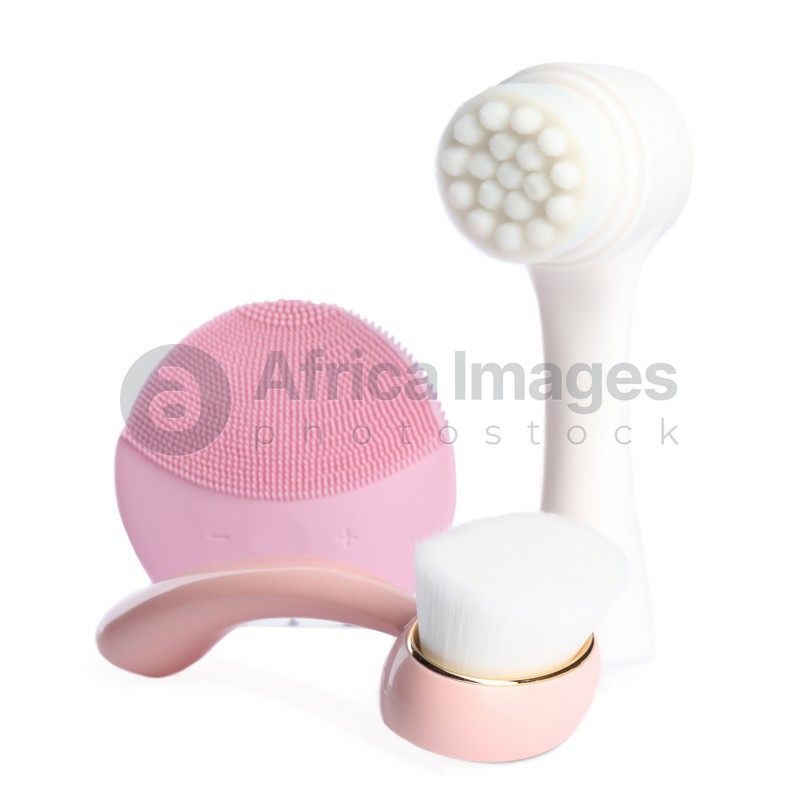 Photo of Face cleansing brushes isolated on white. Cosmetic tools