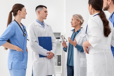 Photo of Team of doctors having discussion in clinic