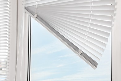 Stylish window with horizontal blinds, closeup view