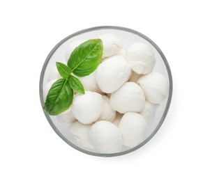 Bowl with mozzarella cheese balls and basil on white background, top view
