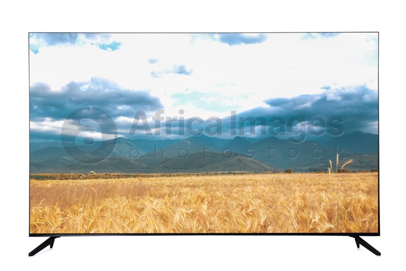 Image of Modern wide screen TV monitor showing picturesque view of wheat field and cloudy sky isolated on white