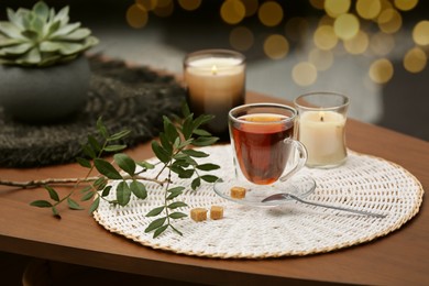 Tea and decorative elements on wooden table indoors