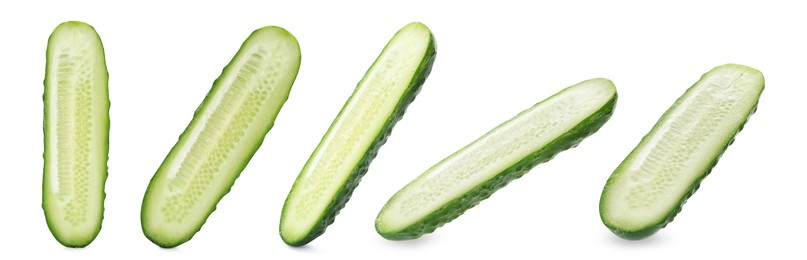 Set with cut ripe cucumbers on white background. Banner design