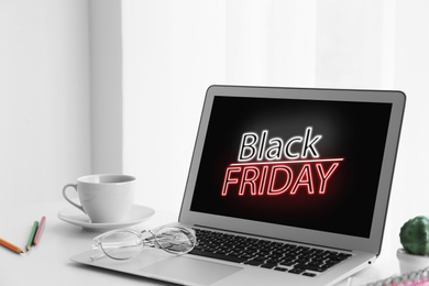 Black Friday announcement on laptop screen. Online shopping