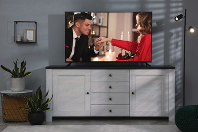 Scene of romantic movie on TV in room