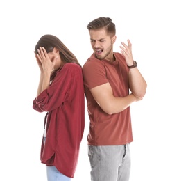 Young couple having argument on white background. Relationship problems