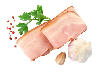 Slices of delicious smoked bacon with parsley, peppercorns and garlic on white background, top view