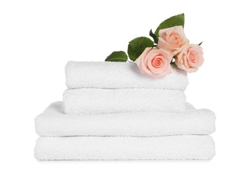 Stack of clean soft towels with flowers isolated on white