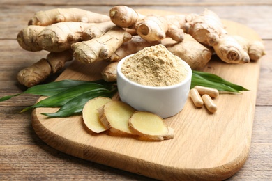 Dry, fresh and capsuled ginger on wooden table
