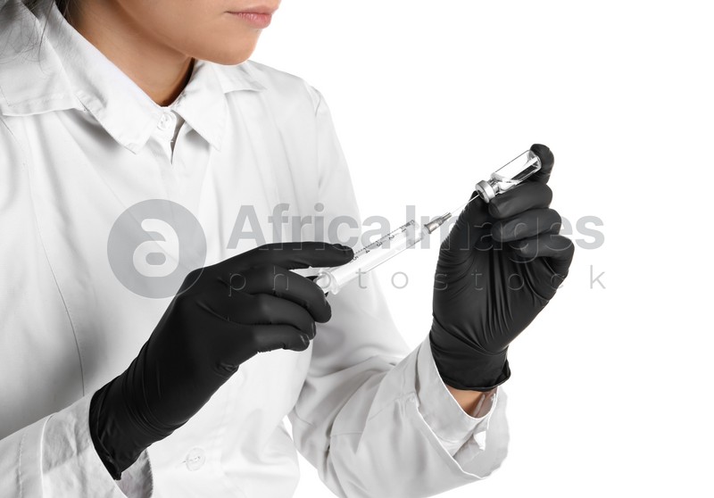 Doctor in medical gloves with syringe and vial on white background