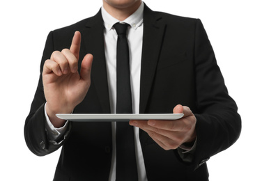 Businessman using tablet computer on white background, closeup