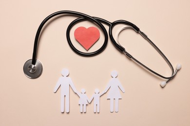 Paper family figures, red heart and stethoscope on beige background, flat lay. Insurance concept