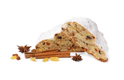 Cut delicious Stollen sprinkled with powdered sugar and ingredients on white background
