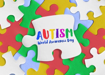Image of World Autism Awareness Day. Many colorful puzzle pieces, top view