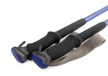 Photo of Pair of trekking poles on white background, closeup. Camping tourism