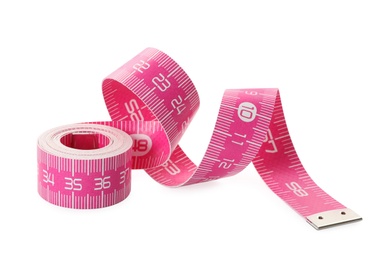 New pink measuring tape isolated on white