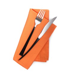 Orange napkin with fork and knife on white background, top view