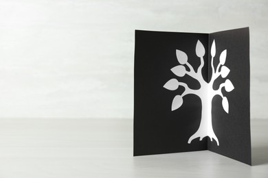 Card with family tree template on light wooden table. Space for text
