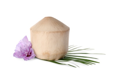Young peeled coconut with palm leaf and beautiful flower isolated on white