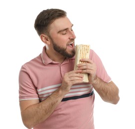 Photo of Young man eating delicious shawarma on white background