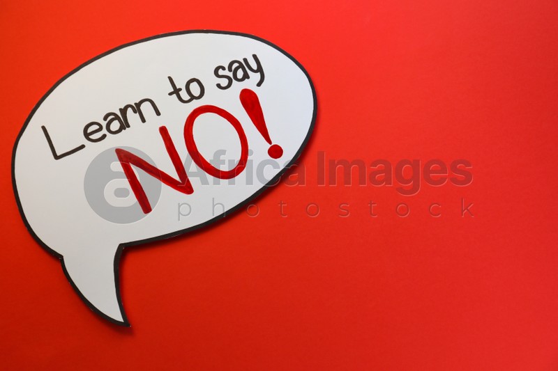 Paper speech bubble with phrase Learn to Say No on red background, top view. Space for text