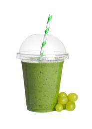 Photo of Plastic cup of detox smoothie and grapes on white background