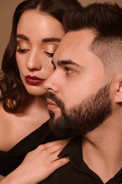 Handsome bearded man with sexy lady, closeup