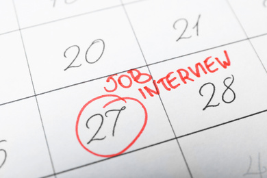 Calendar with date reminder about job interview, closeup