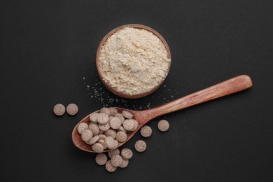 Photo of Different types of brewer`s yeast on black background, flat lay