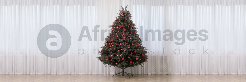 Beautifully decorated Christmas tree indoors. Banner design