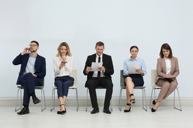 People waiting for job interview in office hall