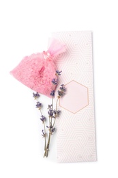 Scented sachets and dried lavender on white background, top view