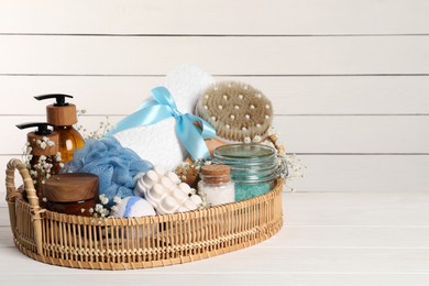 Photo of Spa gift set with different personal care products on white wooden table. Space for text