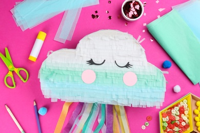 Flat lay composition with cardboard cloud on pink background. Pinata diy