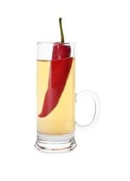 Red hot chili pepper and vodka in shot glass on white background