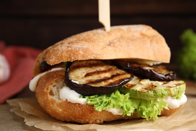 Delicious fresh eggplant sandwich served on table, closeup