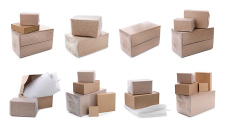 Set with cardboard boxes packed in bubble wrap on white background