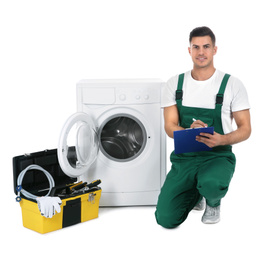 Repairman with clipboard and toolbox near washing machine on white background