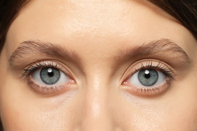 Photo of Beautiful woman with grey eyes, closeup view