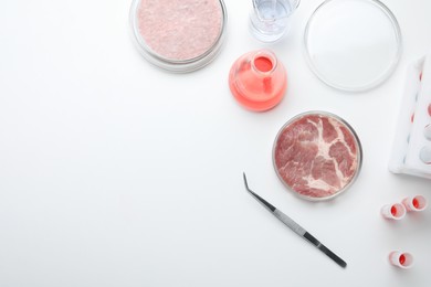Samples of cultured meats on white lab table, flat lay. Space for text