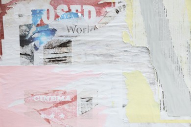 Photo of Different creased torn paper posters as background
